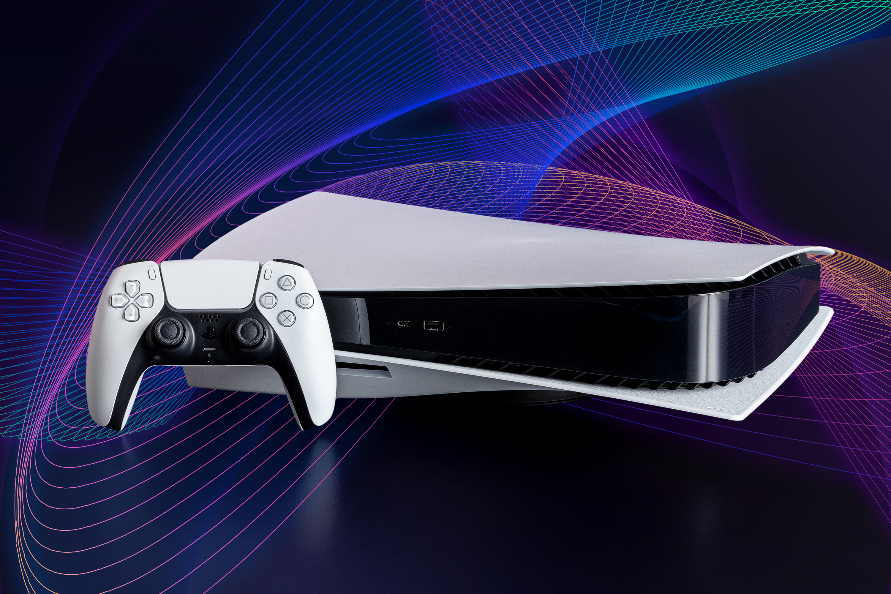 Sony PS5 game console and controller on a dark background with swirling multicolored lines